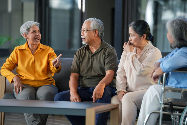 Solentra Wellness | Aged care: Asian medical staff assist a senior woman in a wheelchair